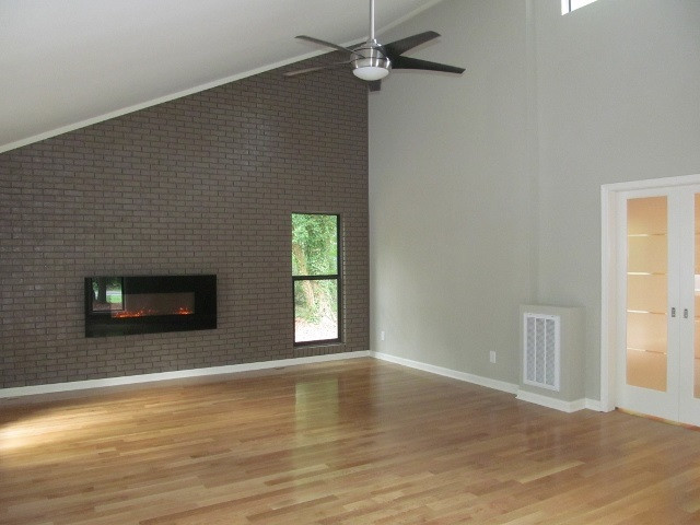 4003 Hope Valley Road Durham, NC 27707 - Photo 14 of 20 The Family area has a vaulted brick accent wall with an electric fireplace. It's really beautiful. Family Room
