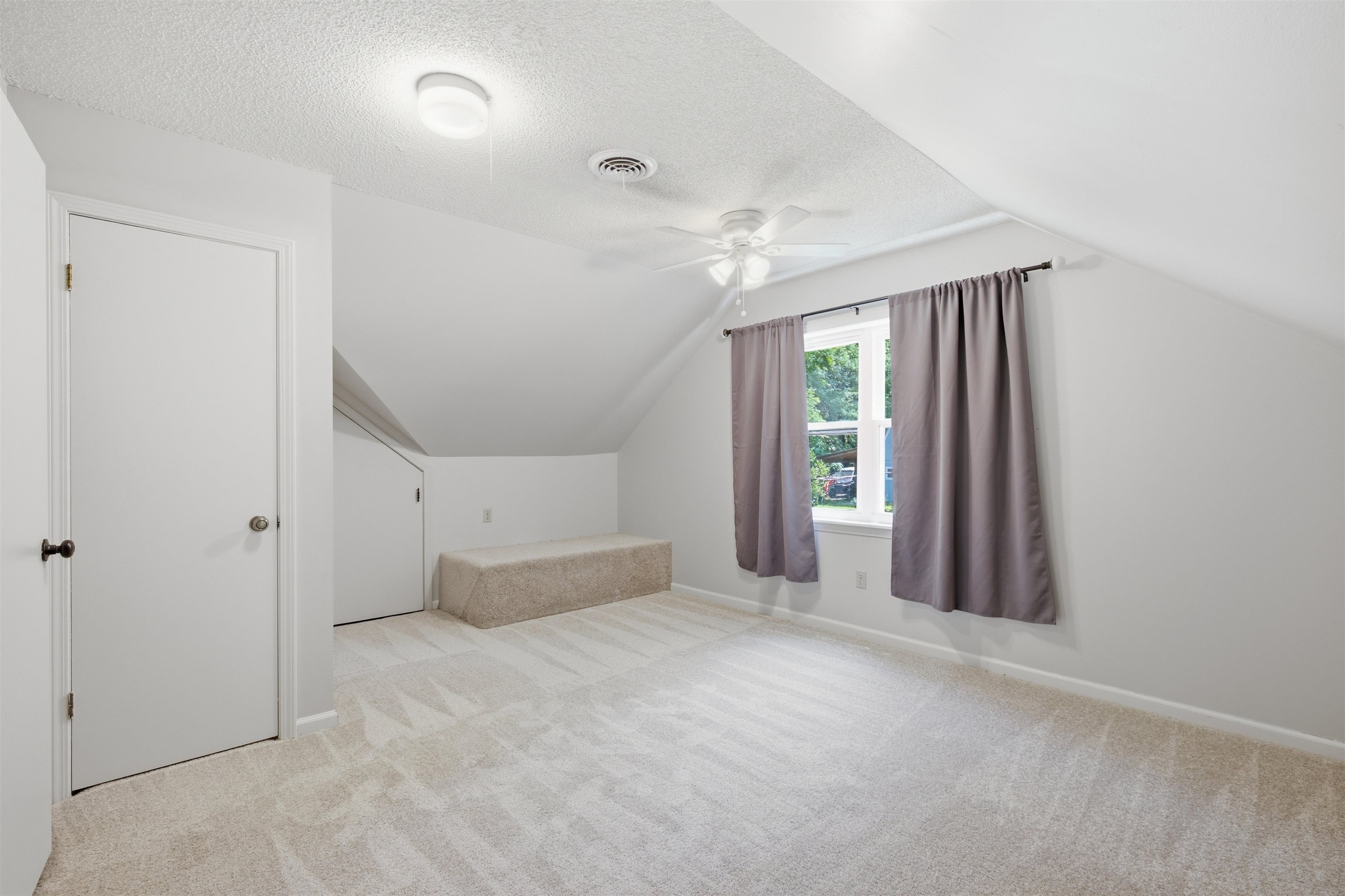 1370 North Reid Hooker Road Eads, TN 38028 - Photo 35 of 39 Carpeted room featuring a ceiling fan, a window with exterior views, and a built-in storage bench