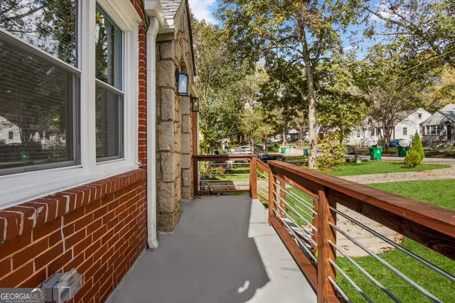 a view of balcony with a yard