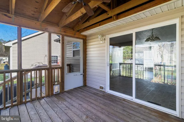 a view of a balcony with wooden floor