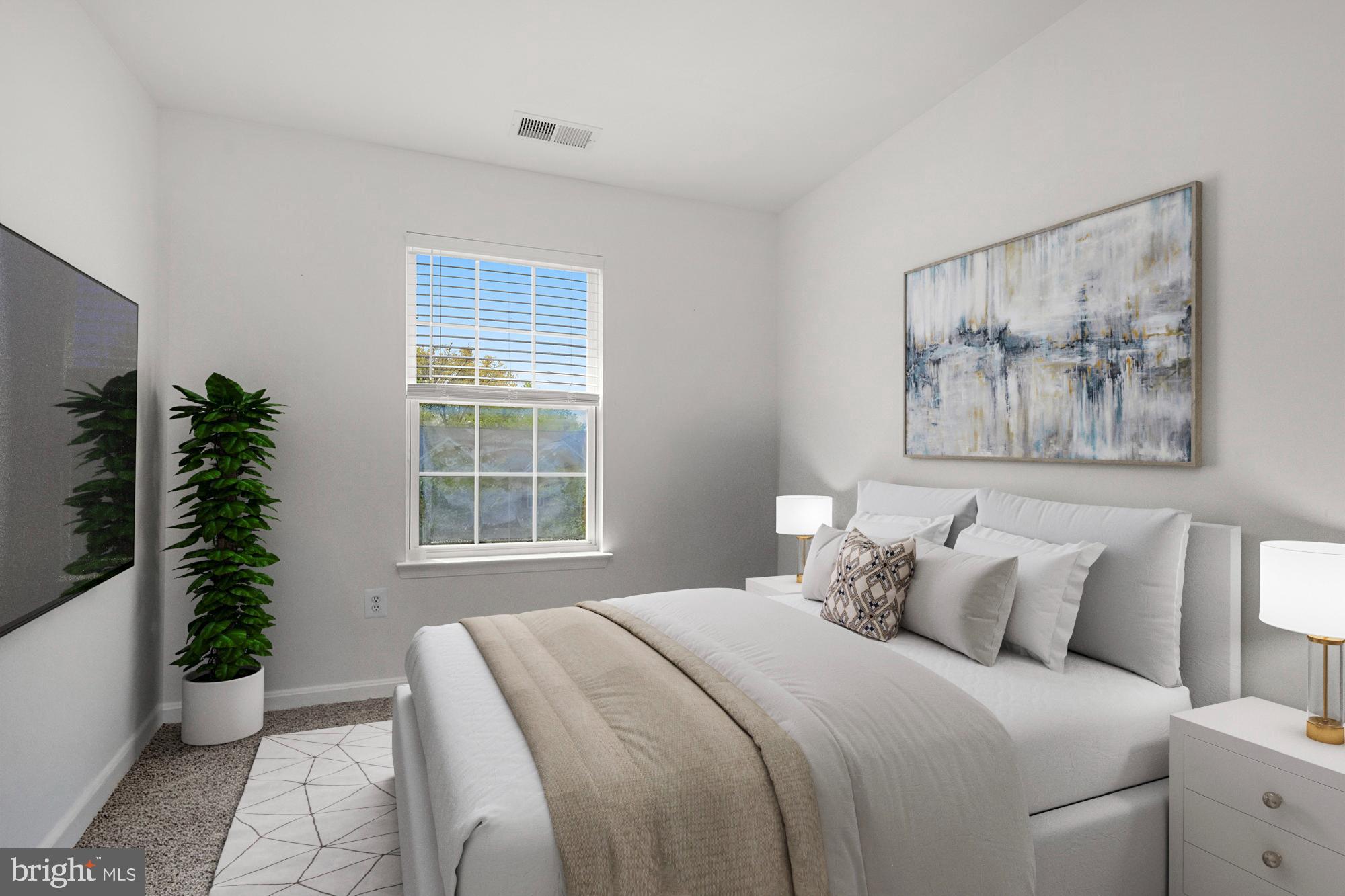 2754 Zeek Lane Lanham, MD 20706 - Photo 15 of 20 a bedroom with a large bed and a potted plant