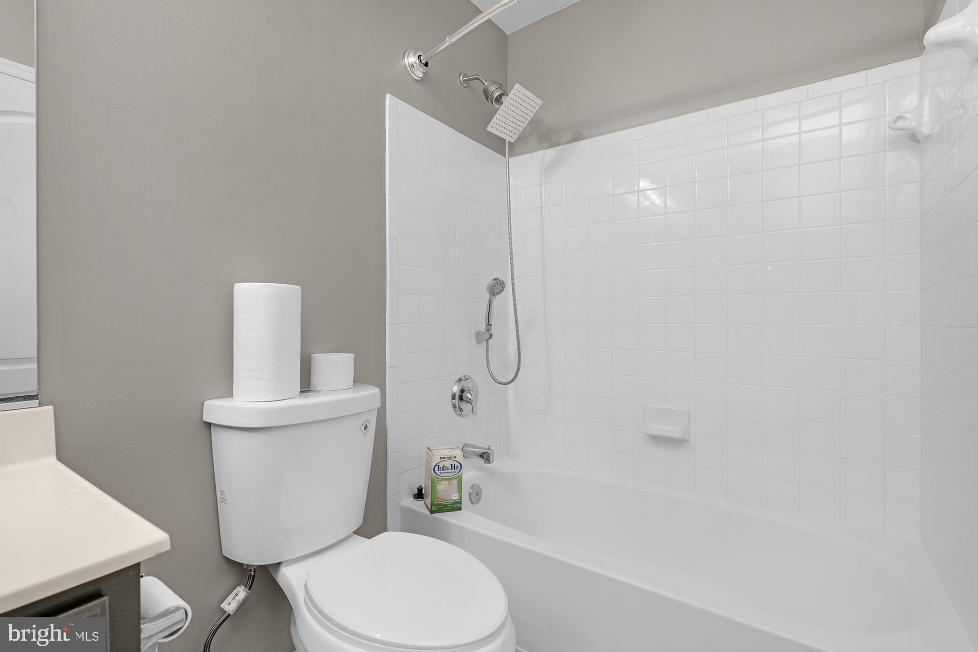 2754 Zeek Lane Lanham, MD 20706 - Photo 17 of 20 a bathroom with a toilet a sink and bathtub