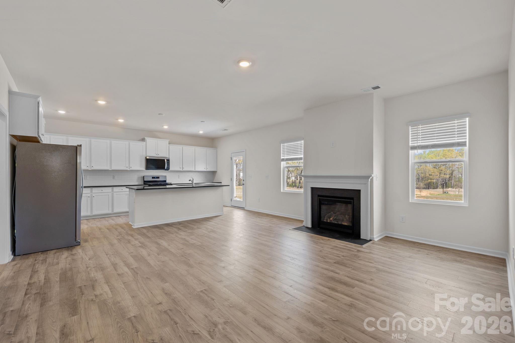 463 Brick House Road York, SC 29745 - Photo 15 of 35 a view of kitchen with livingroom and fireplace