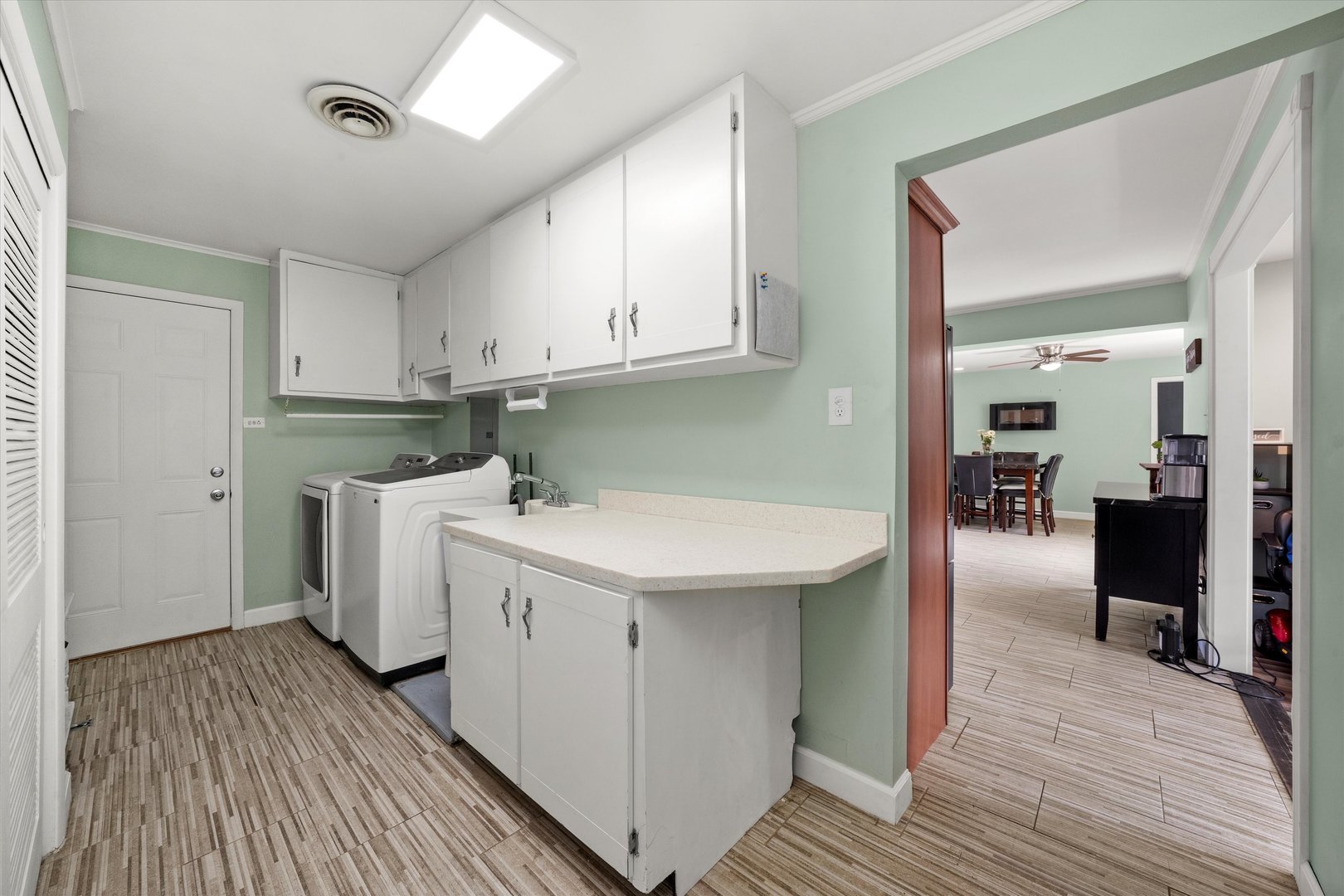 5730 West 110th Street Chicago Ridge, IL 60415 - Photo 30 of 43 a kitchen with a sink and wooden floor