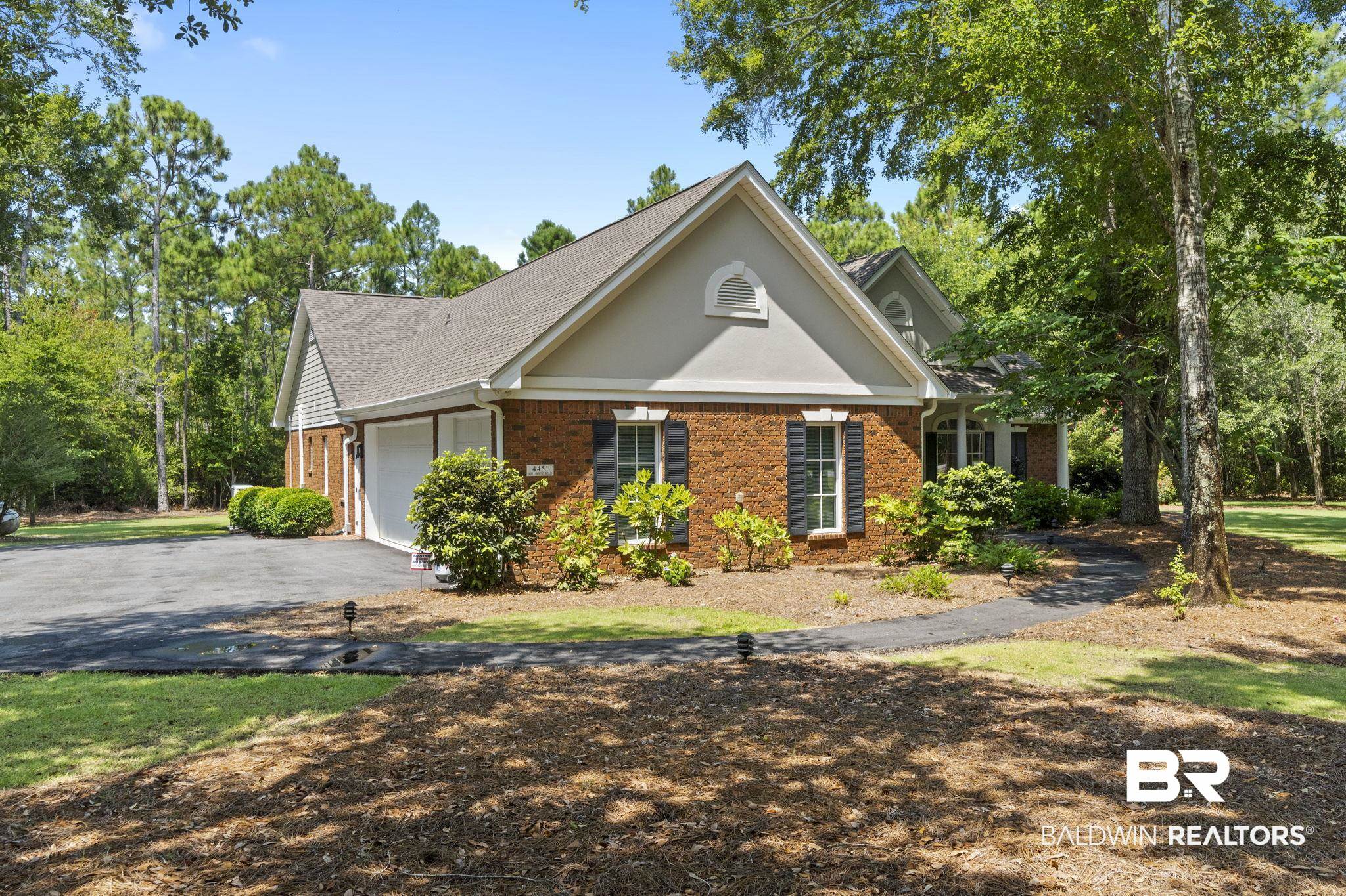 4451 Millhouse Road Gulf Shores, AL 36542 - Photo 4 of 50 View of front of house featuring a garage