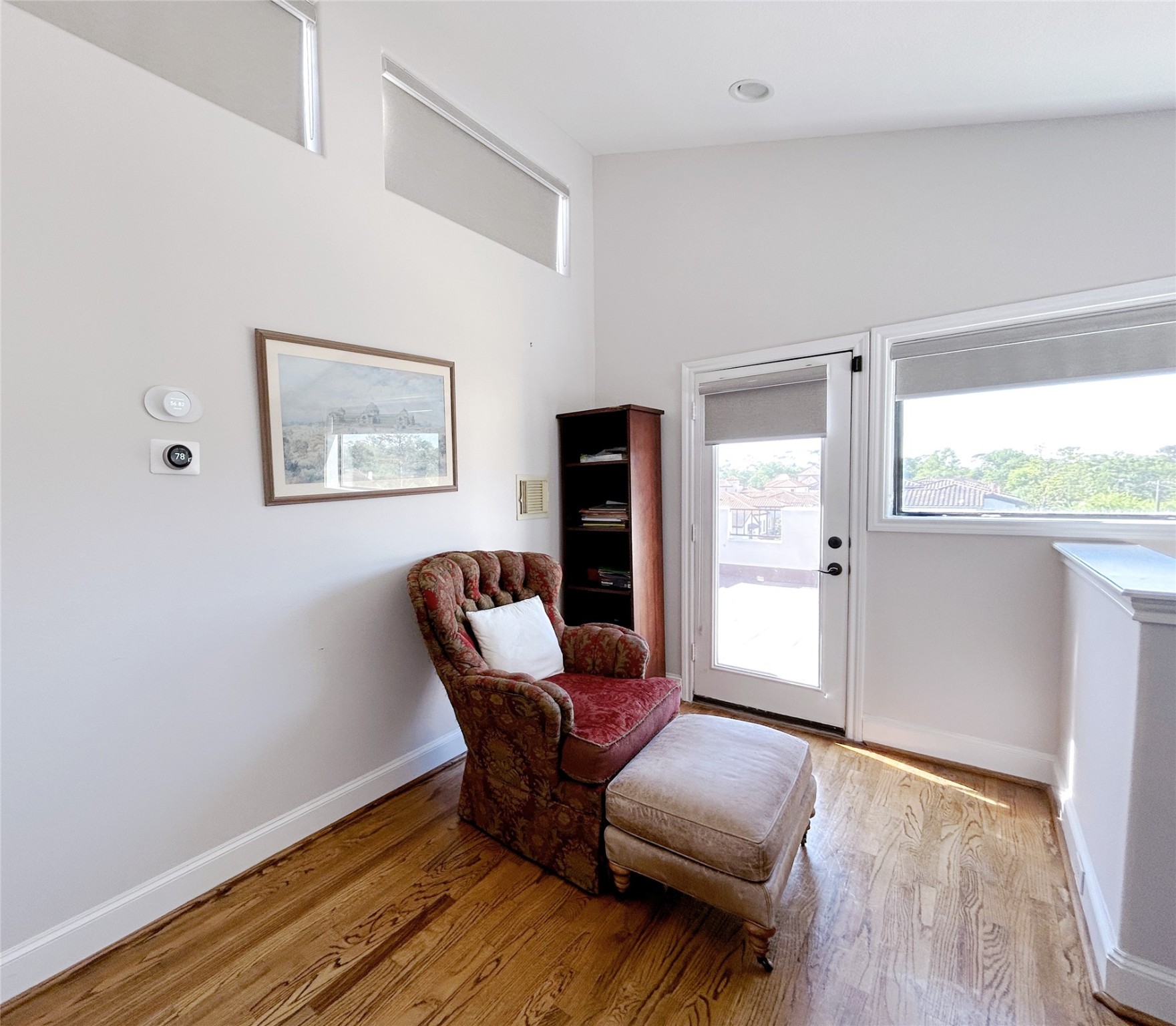 939 Queen Annes Road Houston, TX 77024 - Photo 15 of 40 a view of room with furniture and wooden floor