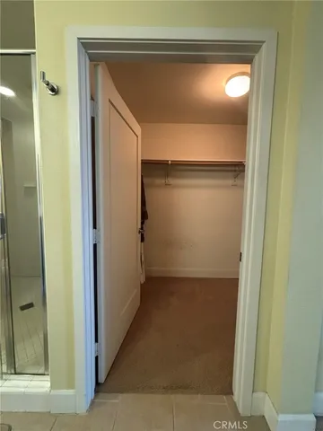 a bathroom with a glass shower door