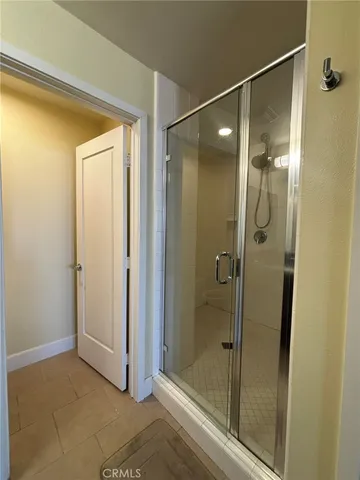 a bathroom with a granite countertop sink double vanity and a mirror