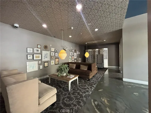 a view of a living room a window and a kitchen