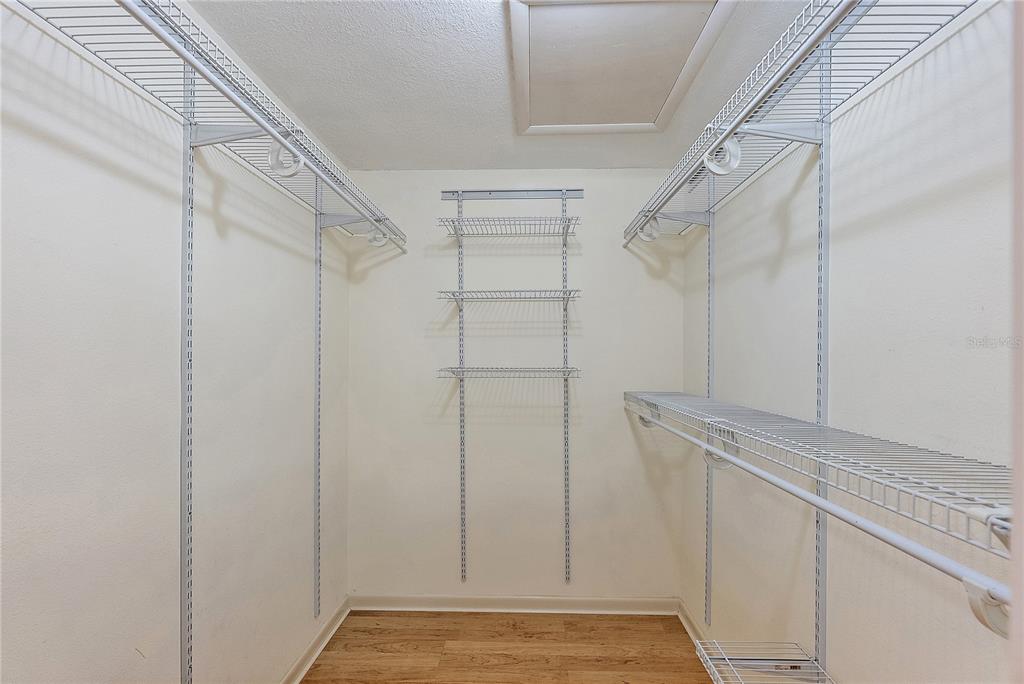 700 Starkey Road, Unit 1525 Largo, FL 33771 - Photo 17 of 46 a view of walk in closet with empty racks
