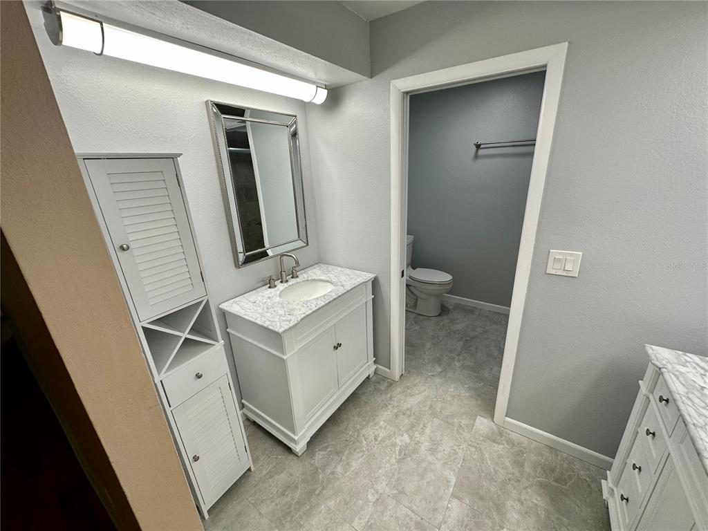 700 Starkey Road, Unit 1525 Largo, FL 33771 - Photo 22 of 46 a bathroom with a sink and a mirror