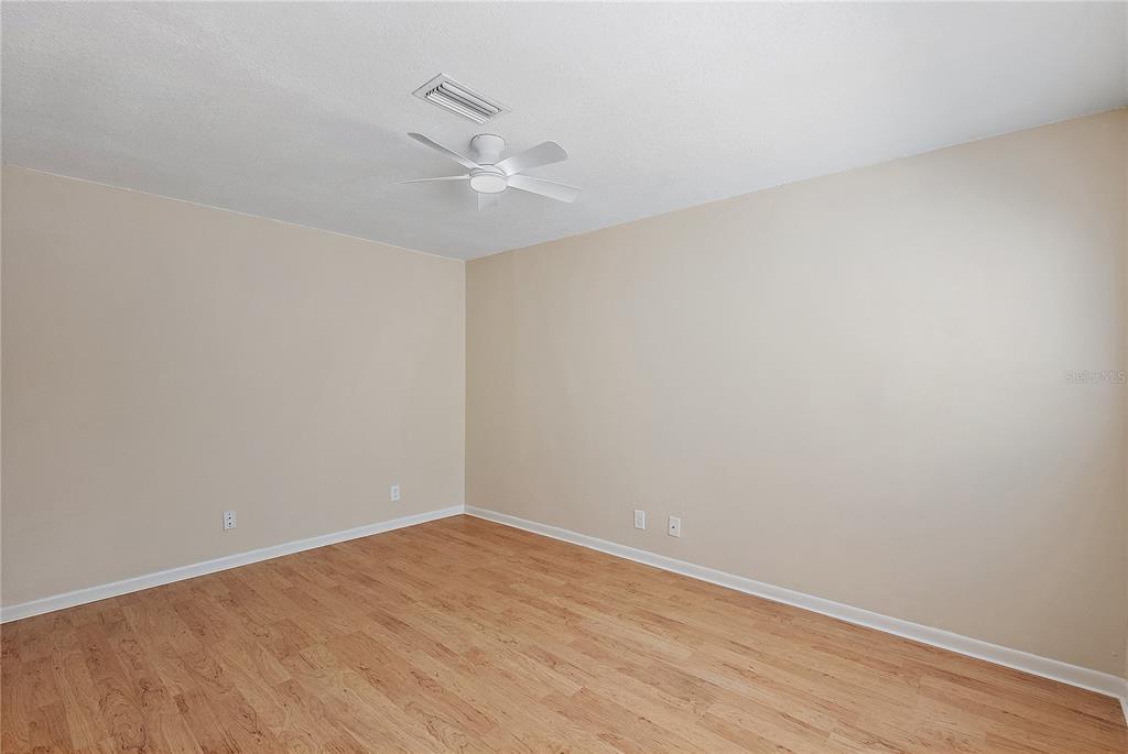 700 Starkey Road, Unit 1525 Largo, FL 33771 - Photo 32 of 46 a view of an empty room with wooden floor