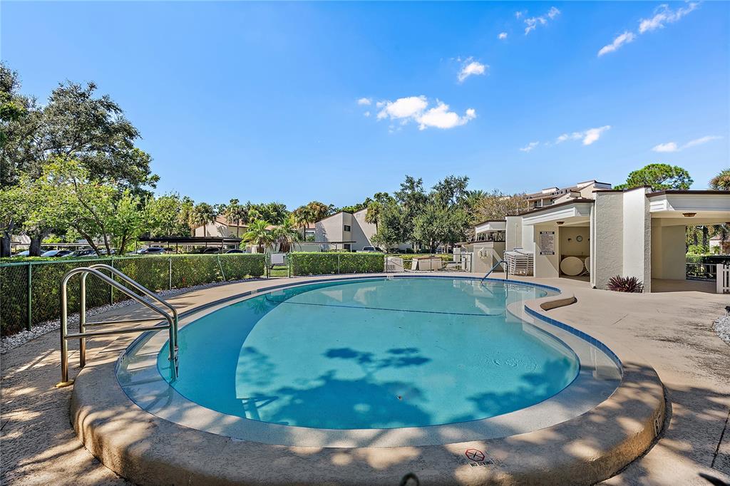 700 Starkey Road, Unit 1525 Largo, FL 33771 - Photo 40 of 46 a view of a swimming pool with a patio