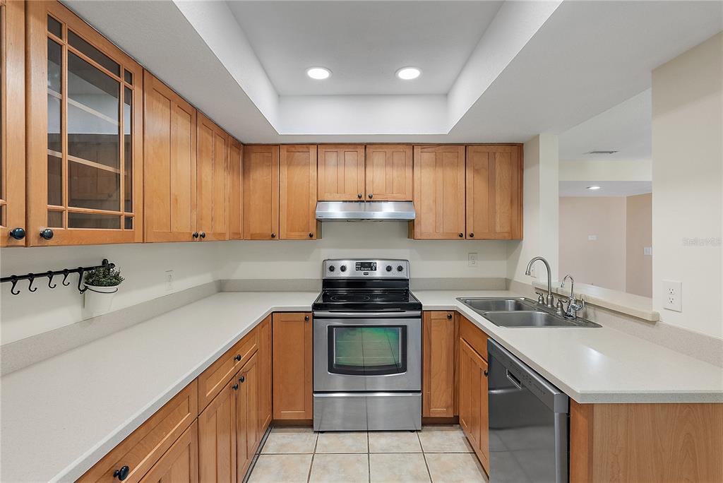 700 Starkey Road, Unit 1525 Largo, FL 33771 - Photo 7 of 46 a kitchen with a sink and a stove top oven