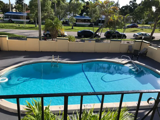 a view of swimming pool with chairs