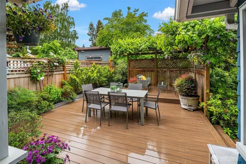 a view of a tables and chairs in patio of the house