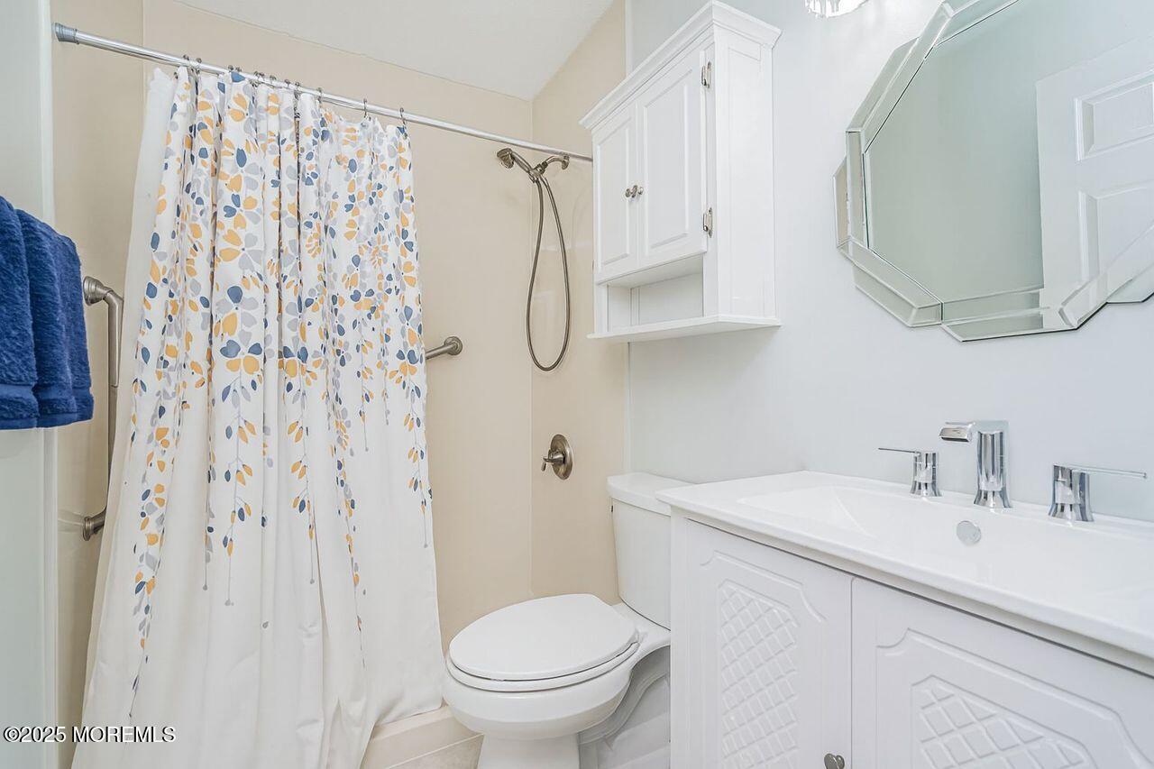 35 Ivy Ridge Close Freehold, NJ 07728 - Photo 13 of 18 a bathroom with a sink toilet and shower