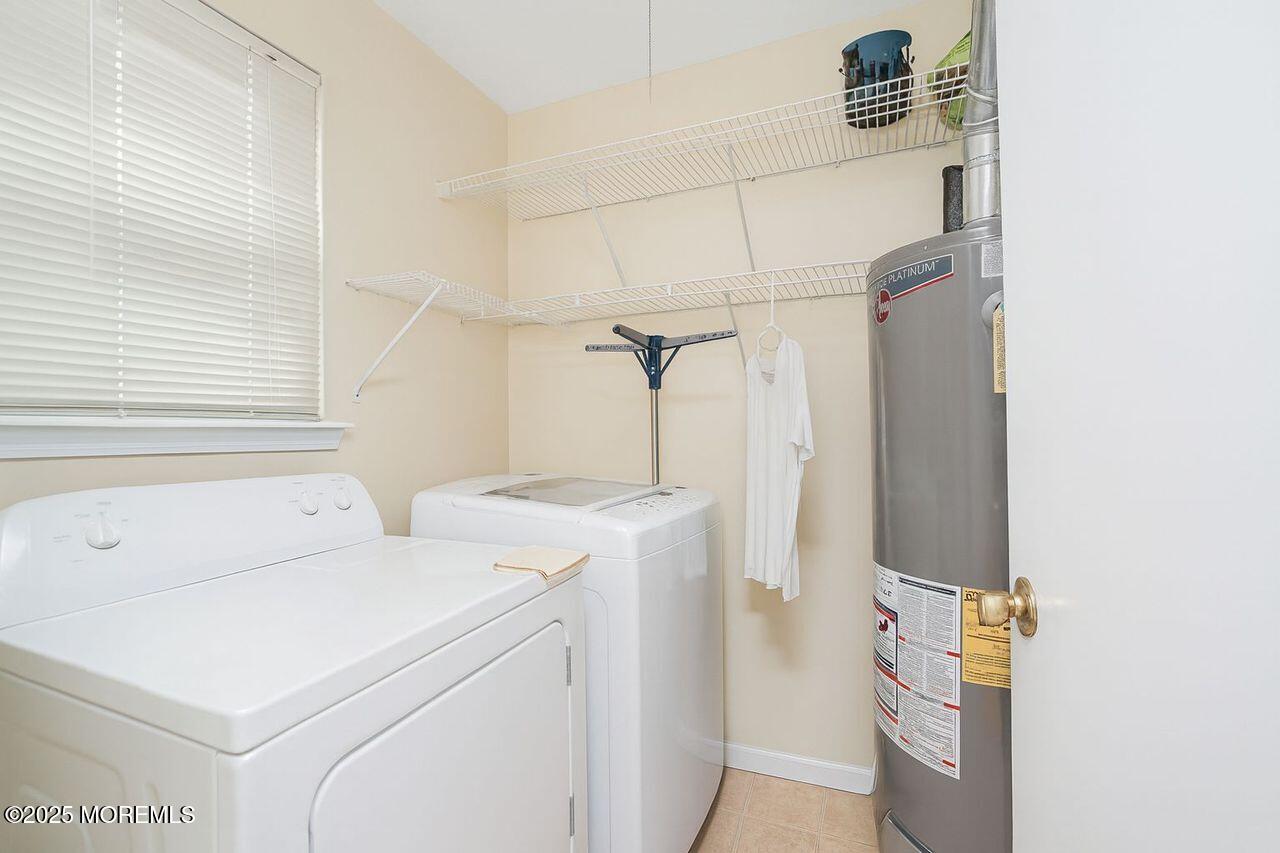 35 Ivy Ridge Close Freehold, NJ 07728 - Photo 14 of 18 a utility room with dryer and washer