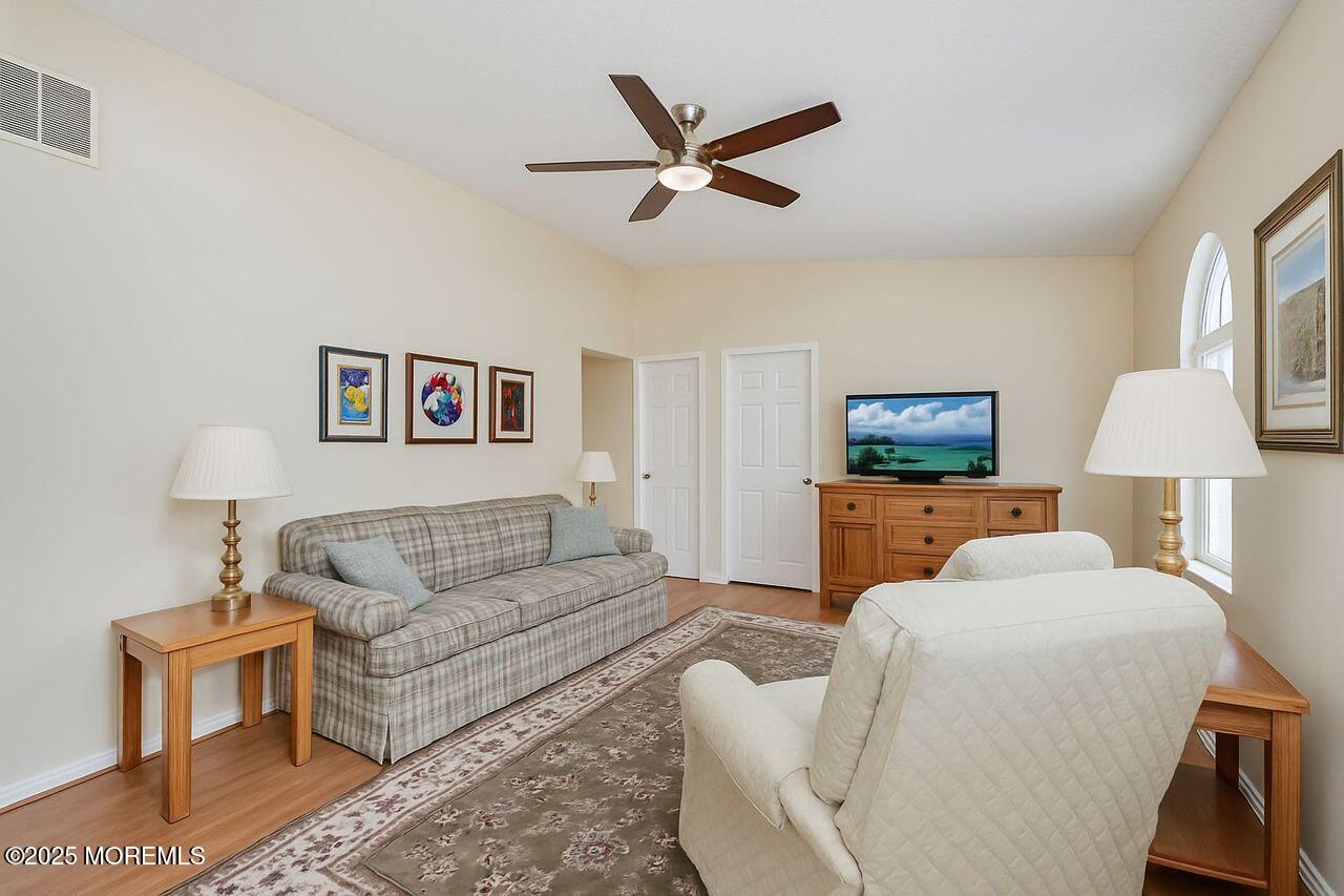 35 Ivy Ridge Close Freehold, NJ 07728 - Photo 2 of 18 a living room with furniture and a lamp
