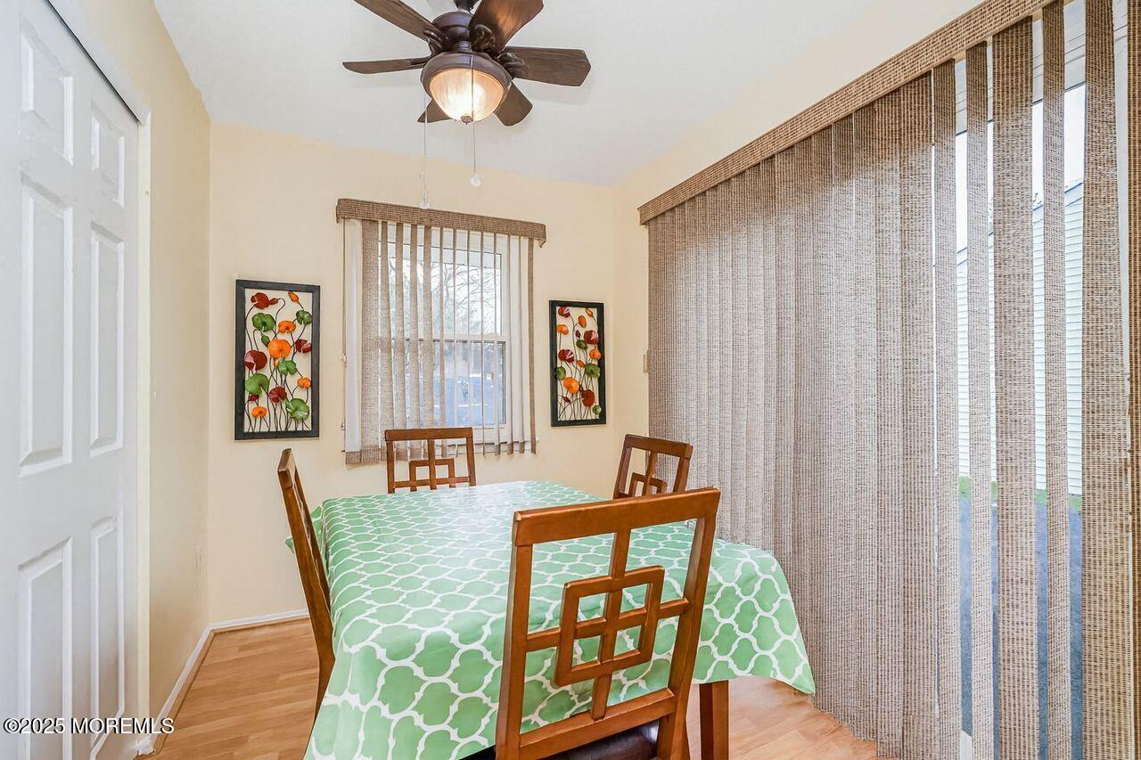 35 Ivy Ridge Close Freehold, NJ 07728 - Photo 8 of 18 a view of a dining room with furniture window and wooden floor