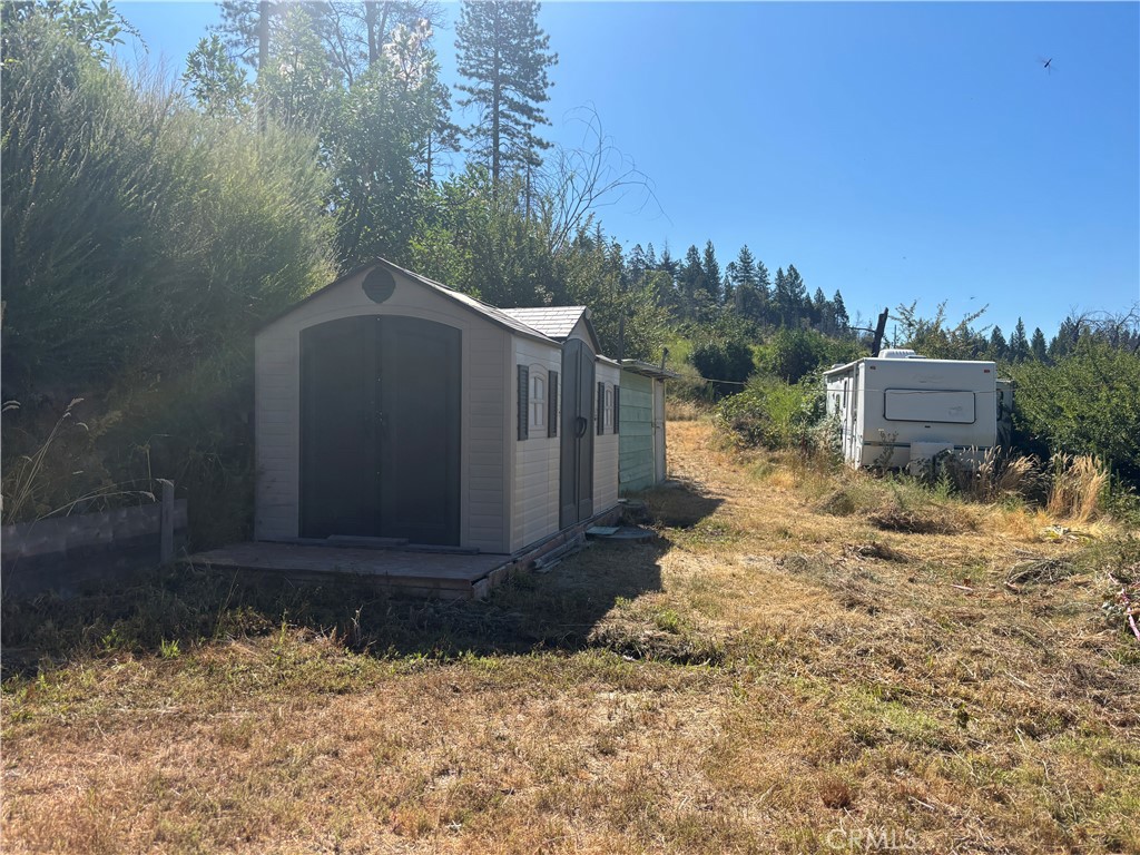 1996 Bald Rock Road Berry Creek, CA 95916 - Photo 15 of 21 a backyard of a house with a yard and outdoor seating