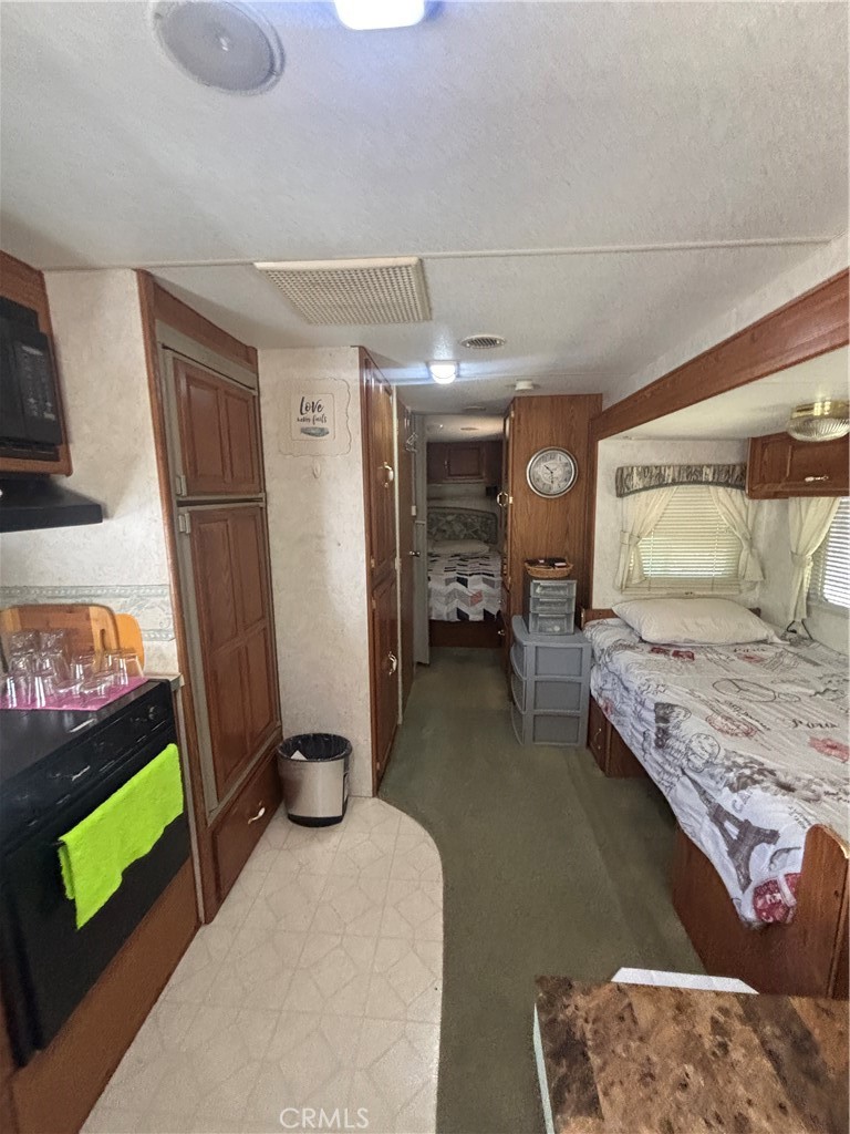 1996 Bald Rock Road Berry Creek, CA 95916 - Photo 18 of 21 a bedroom with a bed and a couch