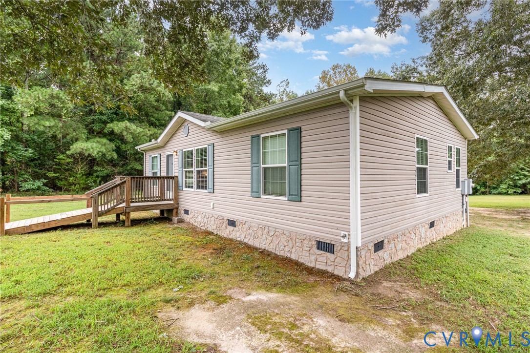 1292 Mt Prospect Road Laneview, VA 22504 - Photo 3 of 25 a view of a house with a yard and sitting area