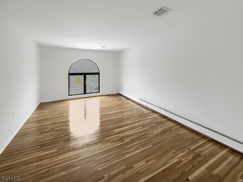16 Knob Hill Road Hackettstown, NJ 07840 - Photo 16 of 41 a view of wooden floor in an empty room
