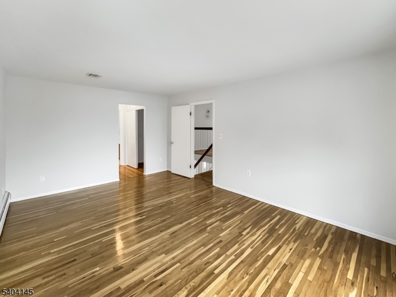 16 Knob Hill Road Hackettstown, NJ 07840 - Photo 16 of 41 a view of empty room with wooden floor