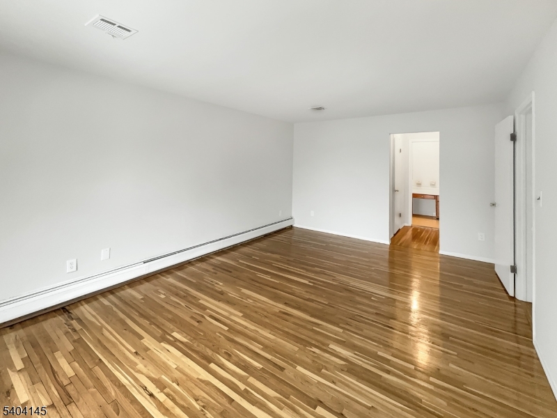 16 Knob Hill Road Hackettstown, NJ 07840 - Photo 18 of 41 a view of empty room with wooden floor