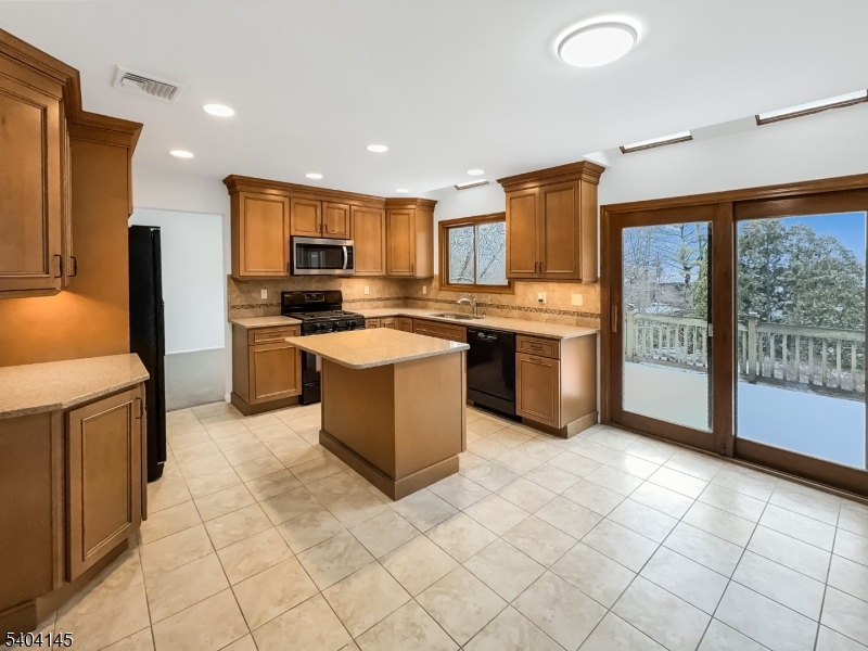 16 Knob Hill Road Hackettstown, NJ 07840 - Photo 2 of 41 a kitchen with stainless steel appliances granite countertop a stove top oven sink and a refrigerator
