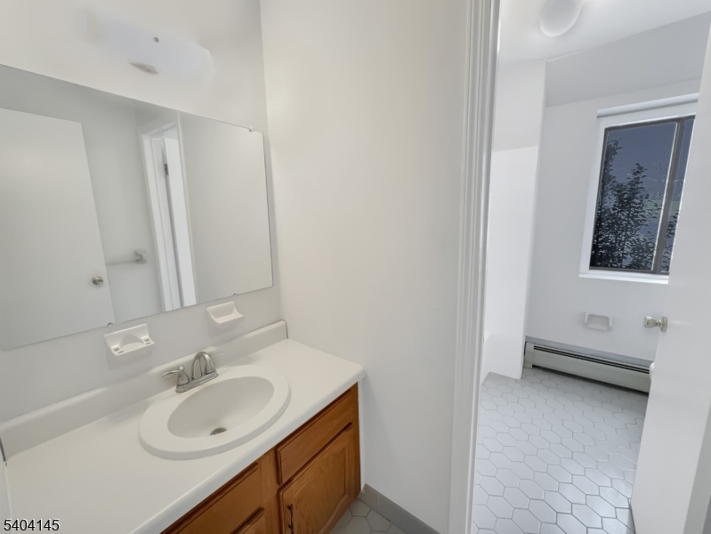 16 Knob Hill Road Hackettstown, NJ 07840 - Photo 23 of 41 a bathroom with a sink and a mirror