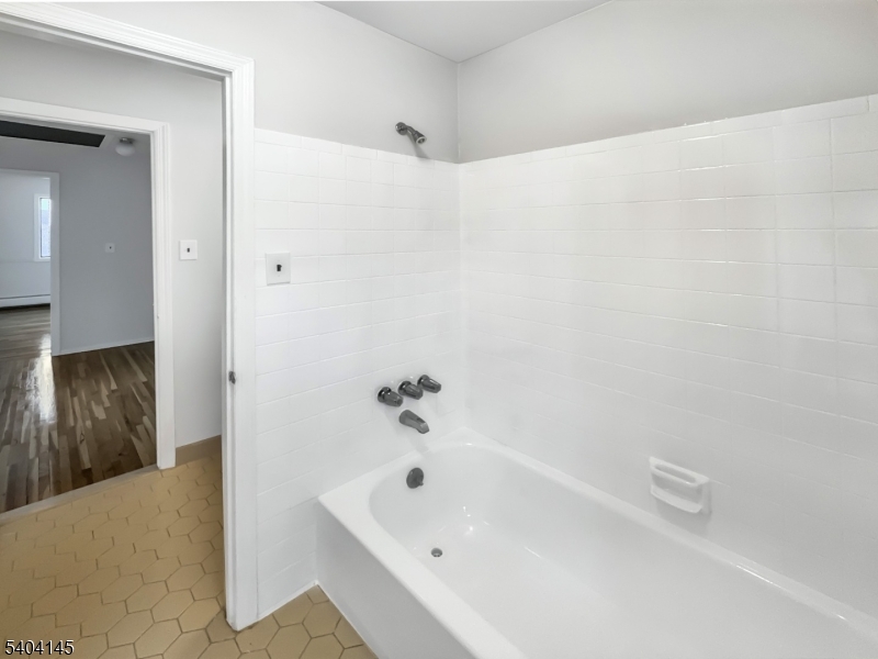 16 Knob Hill Road Hackettstown, NJ 07840 - Photo 24 of 41 a bathroom with a tub shower and a sink