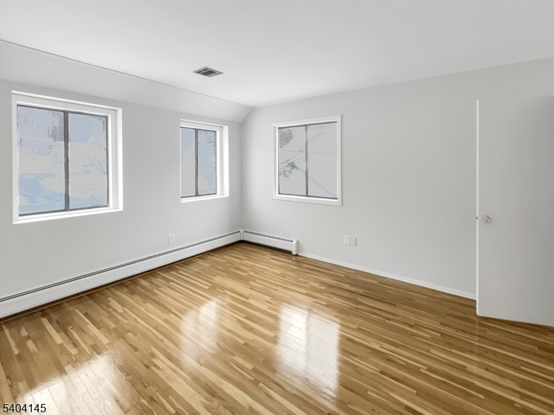 16 Knob Hill Road Hackettstown, NJ 07840 - Photo 26 of 41 a view of an empty room with wooden floor and a window