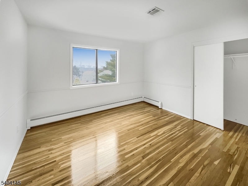 16 Knob Hill Road Hackettstown, NJ 07840 - Photo 29 of 41 a view of empty room with wooden floor and fan