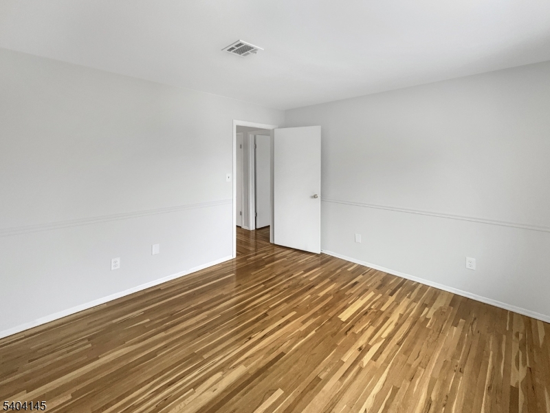 16 Knob Hill Road Hackettstown, NJ 07840 - Photo 30 of 41 a view of empty room with wooden floor