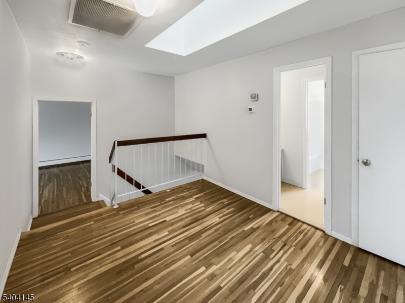 16 Knob Hill Road Hackettstown, NJ 07840 - Photo 31 of 41 a bedroom with a bed and wooden floor