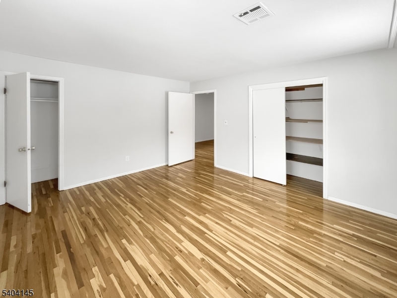 16 Knob Hill Road Hackettstown, NJ 07840 - Photo 4 of 41 a view of empty room with wooden floor