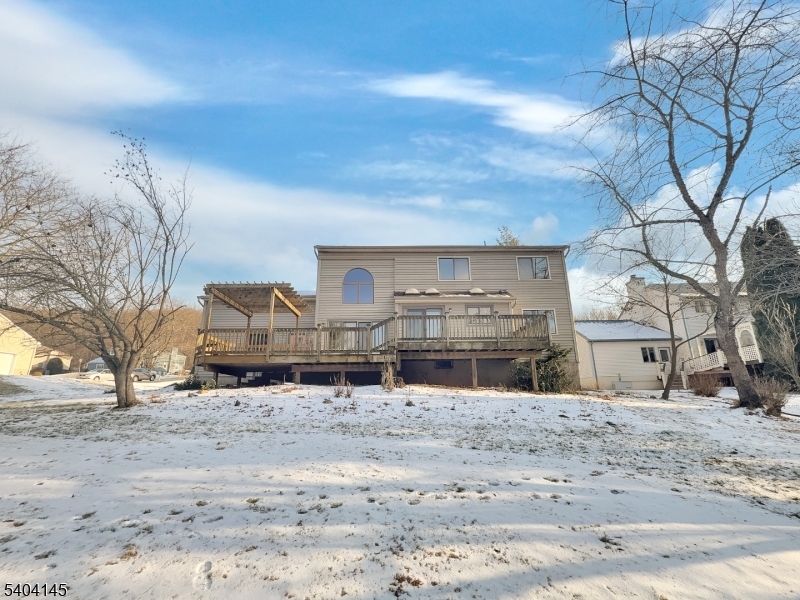 16 Knob Hill Road Hackettstown, NJ 07840 - Photo 5 of 41 a view of a house with a yard covered in snow
