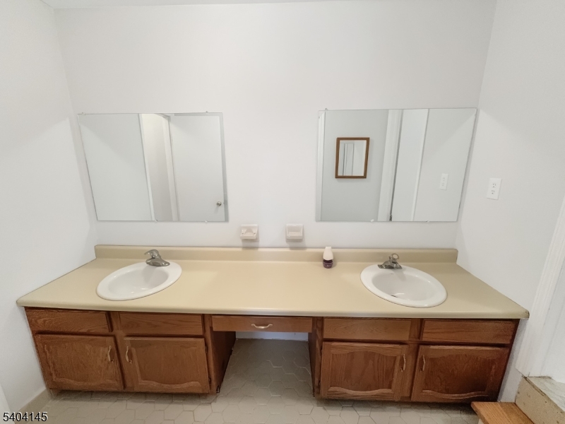 16 Knob Hill Road Hackettstown, NJ 07840 - Photo 6 of 41 a bathroom with a sink and a mirror