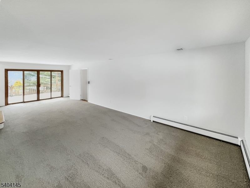 16 Knob Hill Road Hackettstown, NJ 07840 - Photo 6 of 41 a view of an empty room with a window
