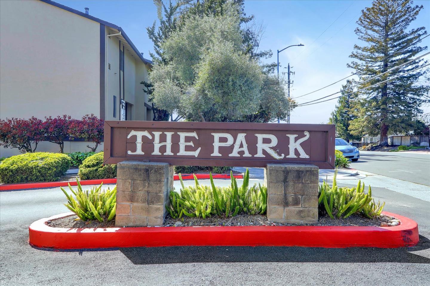 a view of a brick house with a yard