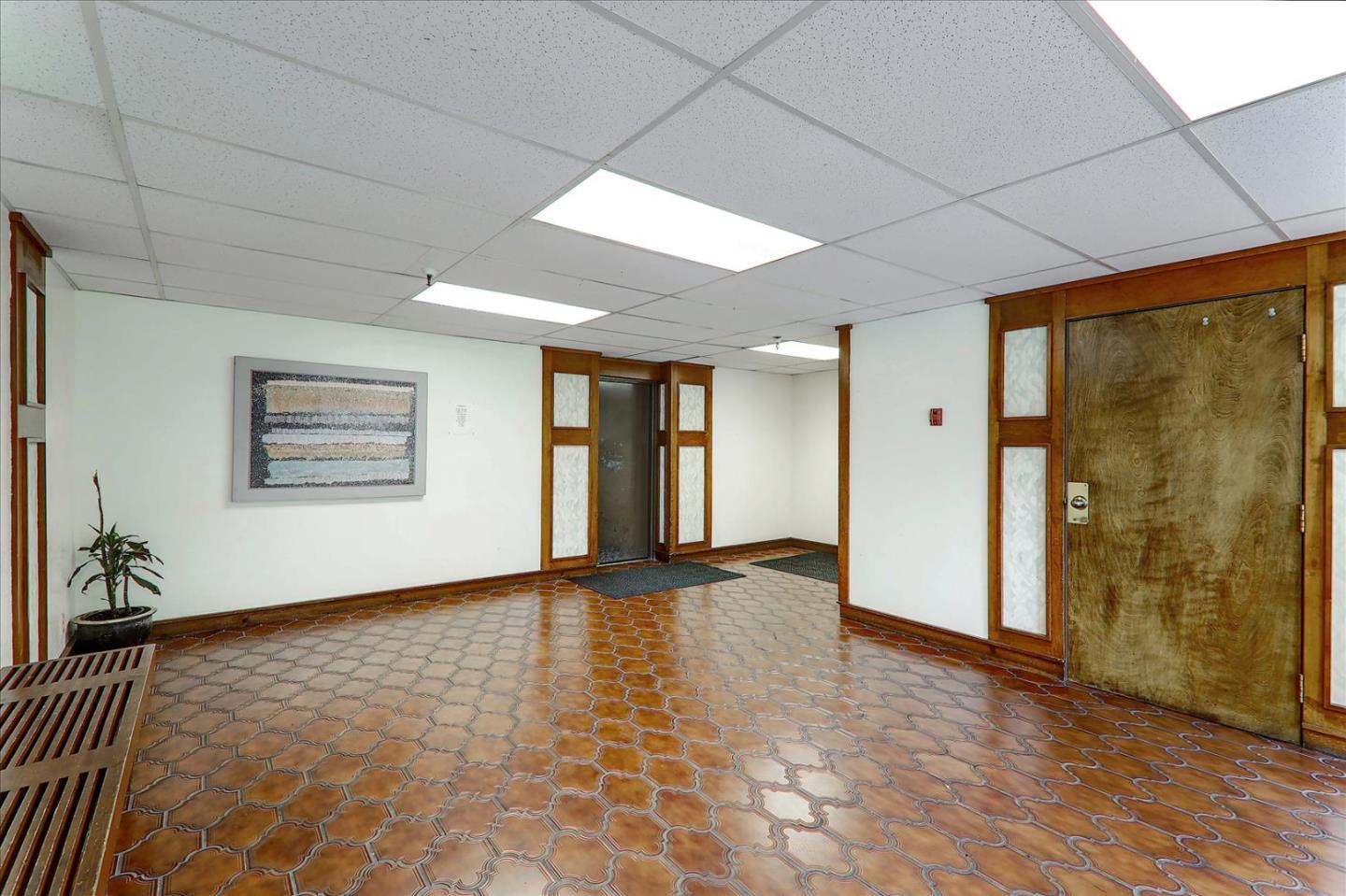 1775 Panda Way, Unit 103 Hayward, CA 94541 - Photo 11 of 33 a view of an empty room with window and wooden floor