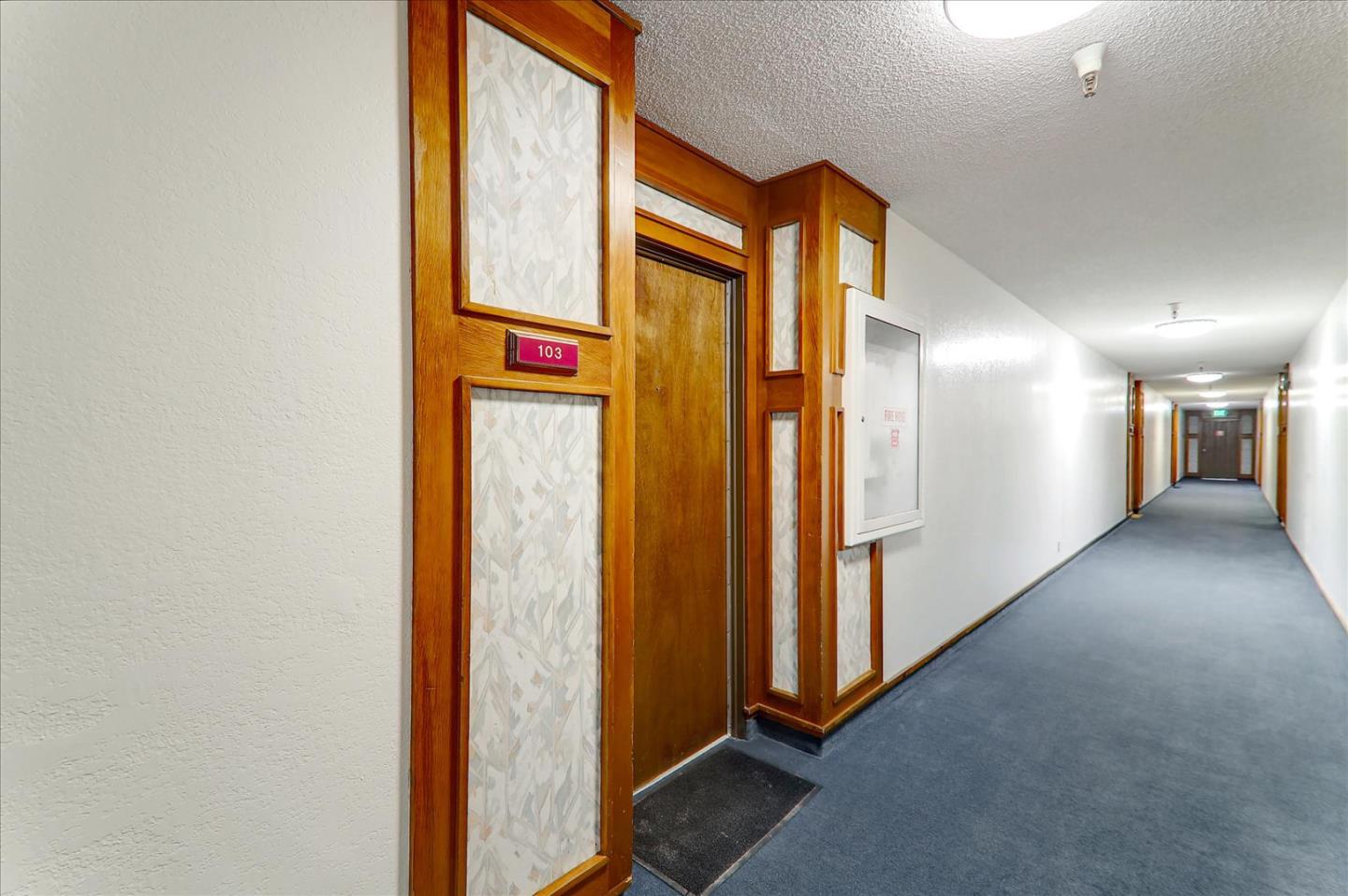 1775 Panda Way, Unit 103 Hayward, CA 94541 - Photo 12 of 33 a view of a hallway with wooden floor