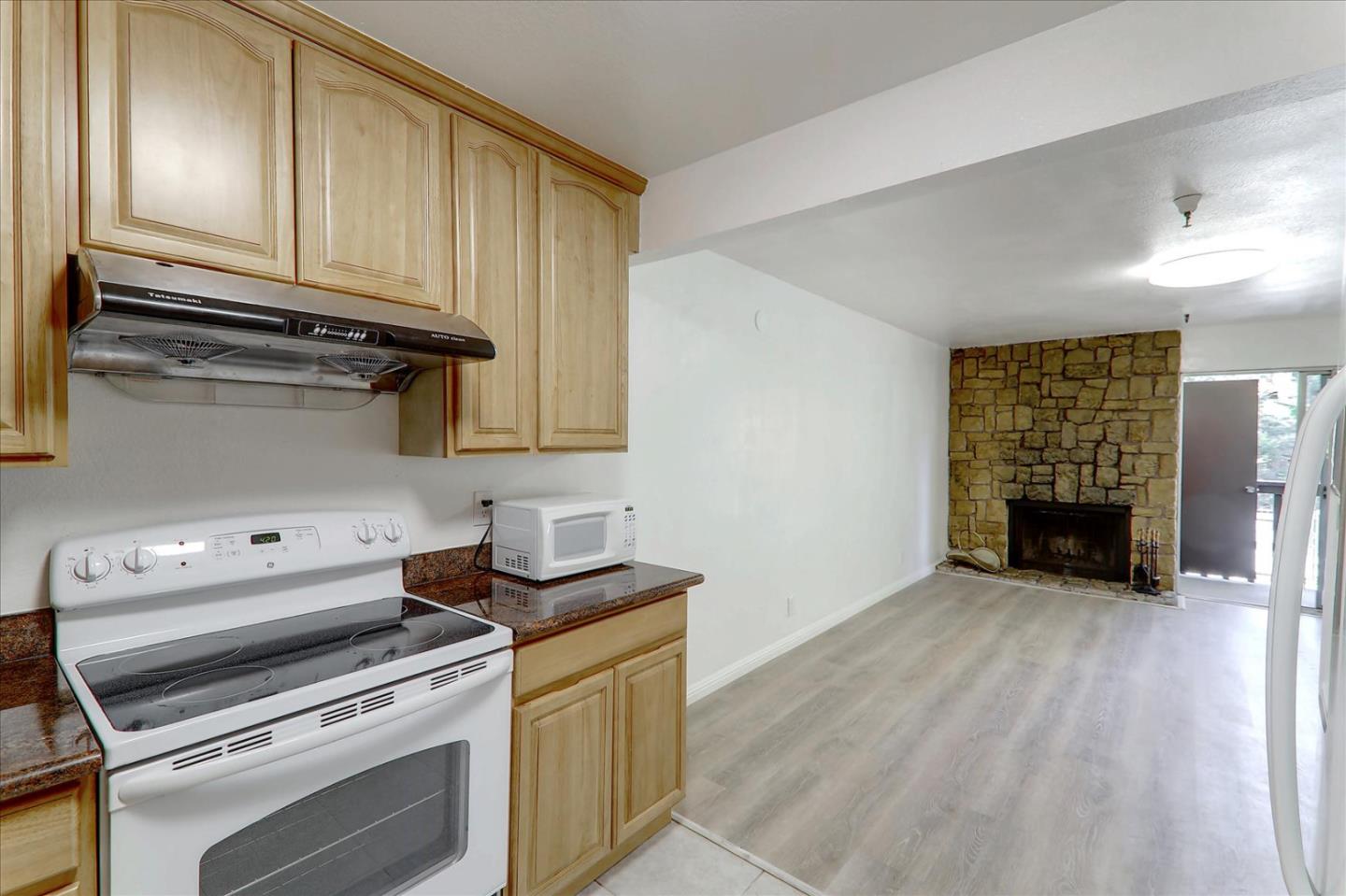 1775 Panda Way, Unit 103 Hayward, CA 94541 - Photo 18 of 33 a kitchen with a stove and a microwave