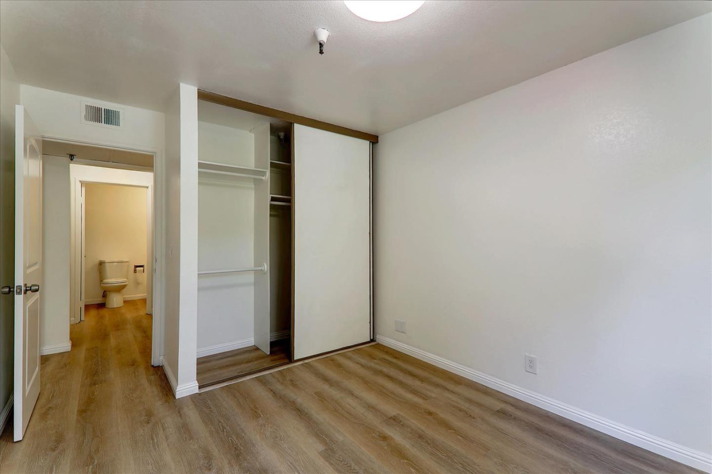 1775 Panda Way, Unit 103 Hayward, CA 94541 - Photo 22 of 33 a view of hallway with wooden floor