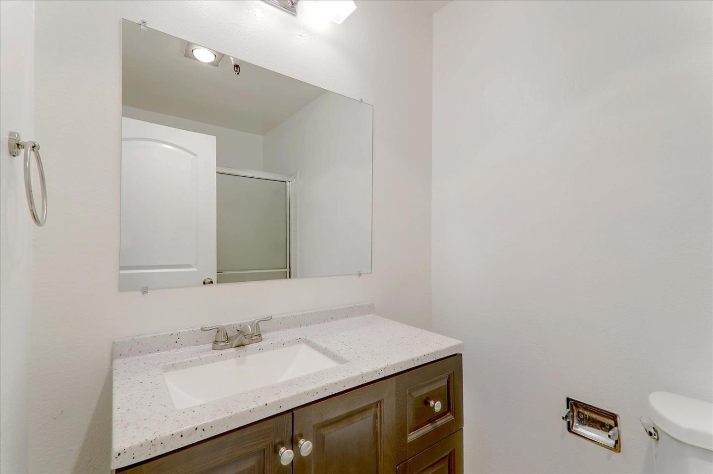 1775 Panda Way, Unit 103 Hayward, CA 94541 - Photo 23 of 33 a bathroom with a sink vanity and a mirror