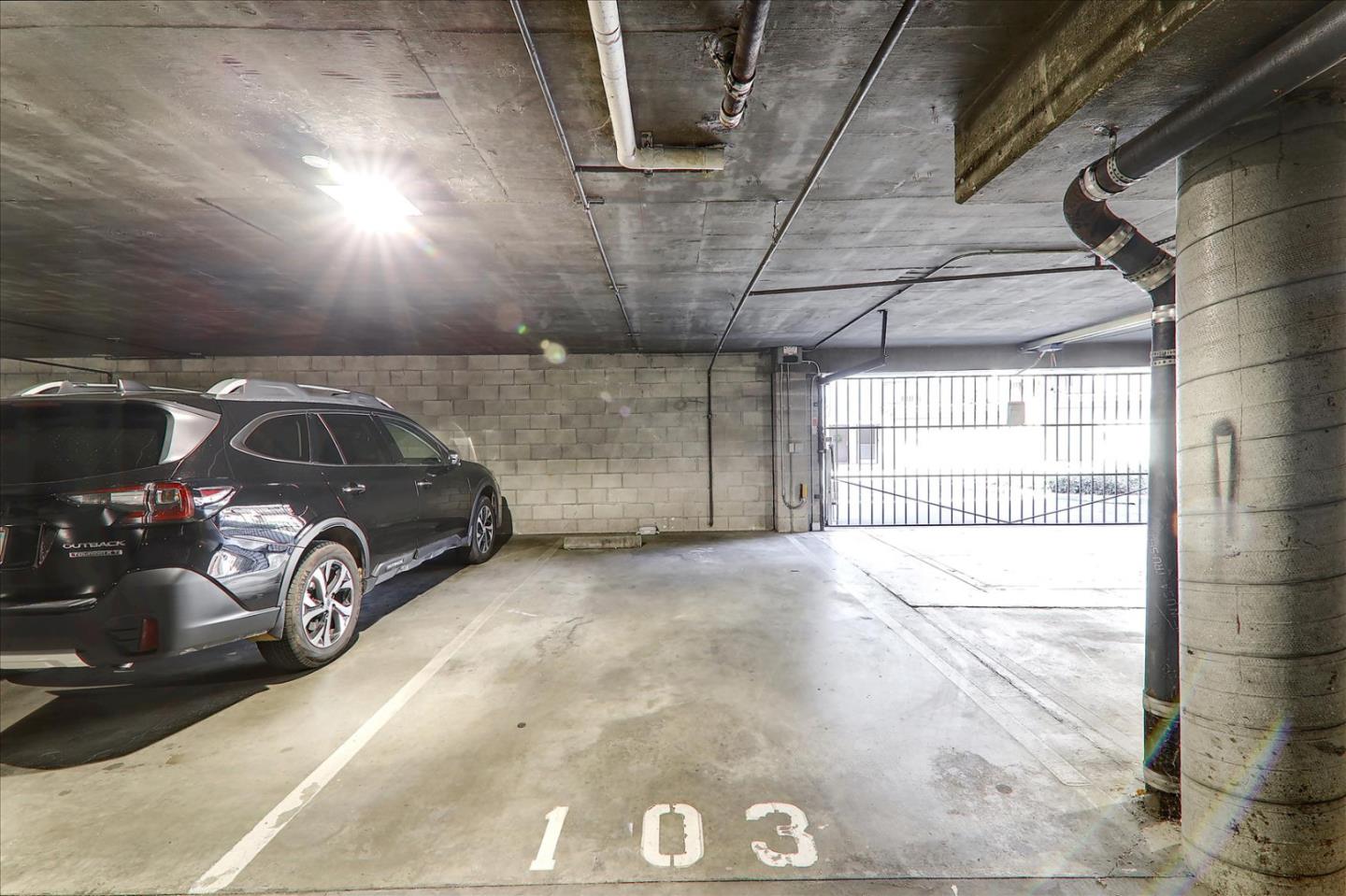 1775 Panda Way, Unit 103 Hayward, CA 94541 - Photo 32 of 33 a view of parking garage with cars parked