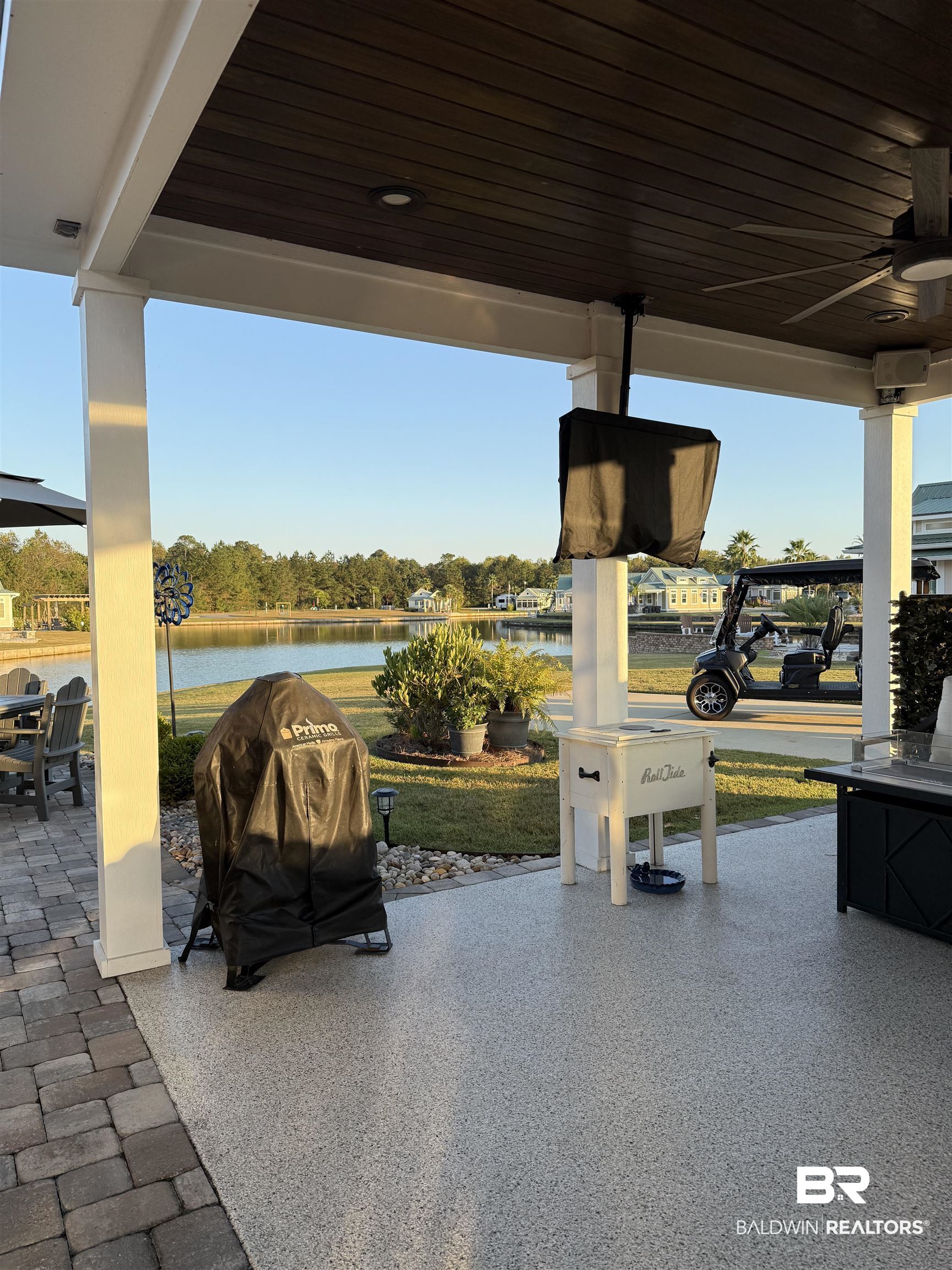 28238 Migratory Way Elberta, AL 36530 - Photo 12 of 58 View of patio / terrace with ceiling fan, a water view, area for grilling, and outdoor dining space