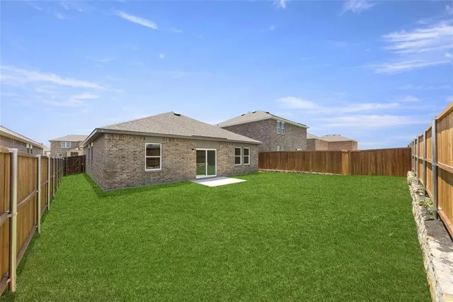 a view of a yard in front of a house with a yard